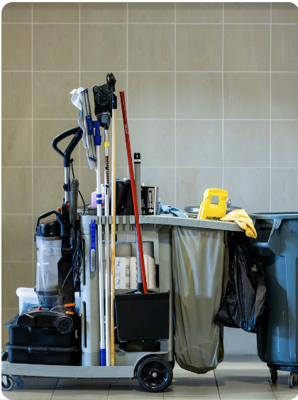 Commercial cleaning cart with mops, broom and supplies